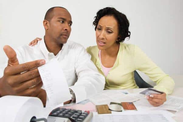 black couple reviewing budget